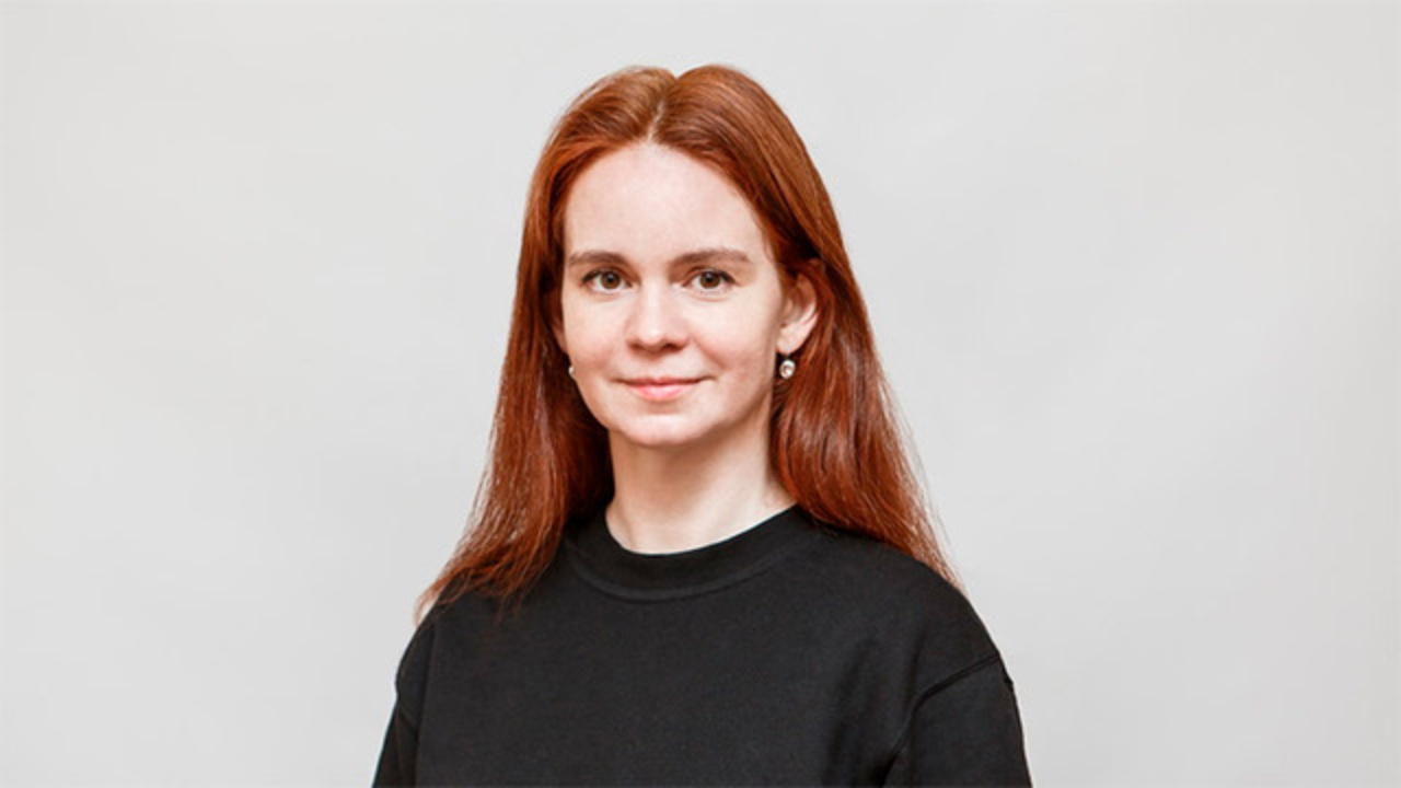 Portrait of a person in front of a white background.