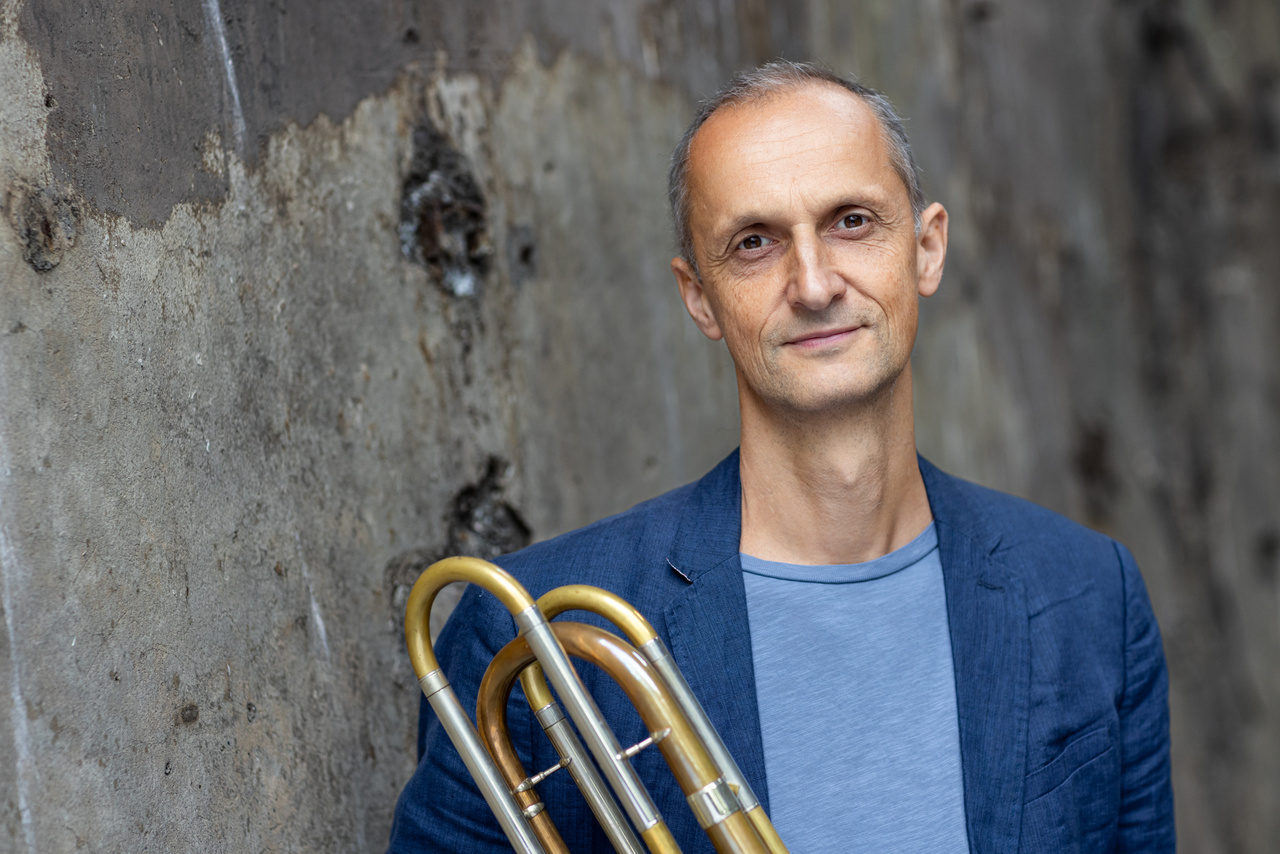 A portrait photo of a person is shown. 