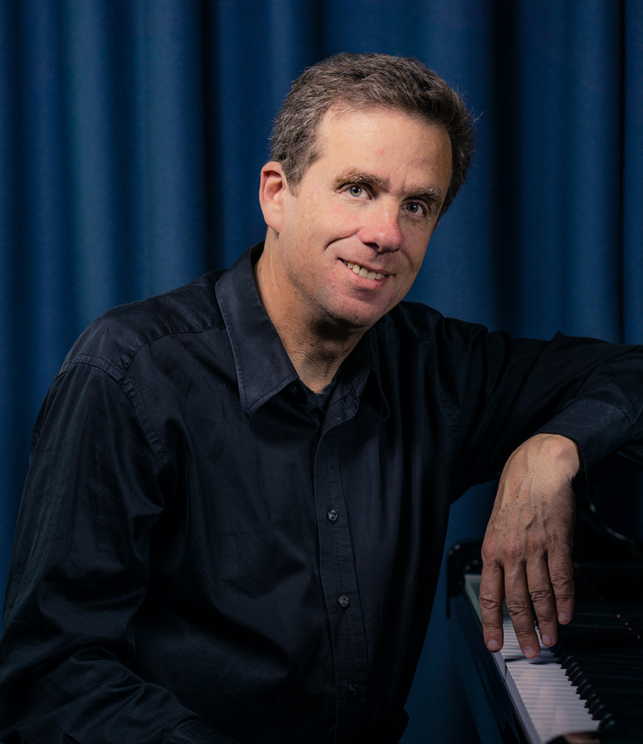 Zu sehen ist das Portraitfoto einer Person. 