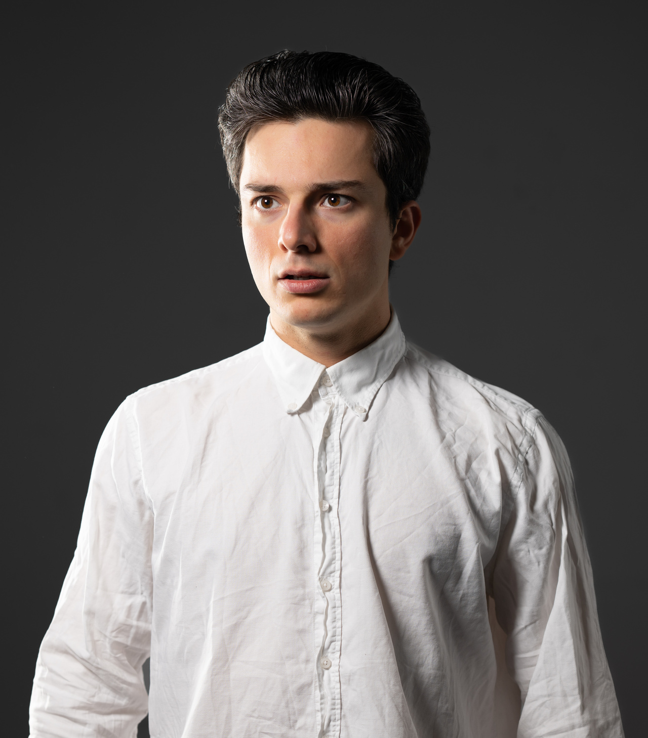 A portrait photo of Finn Baygan is shown.