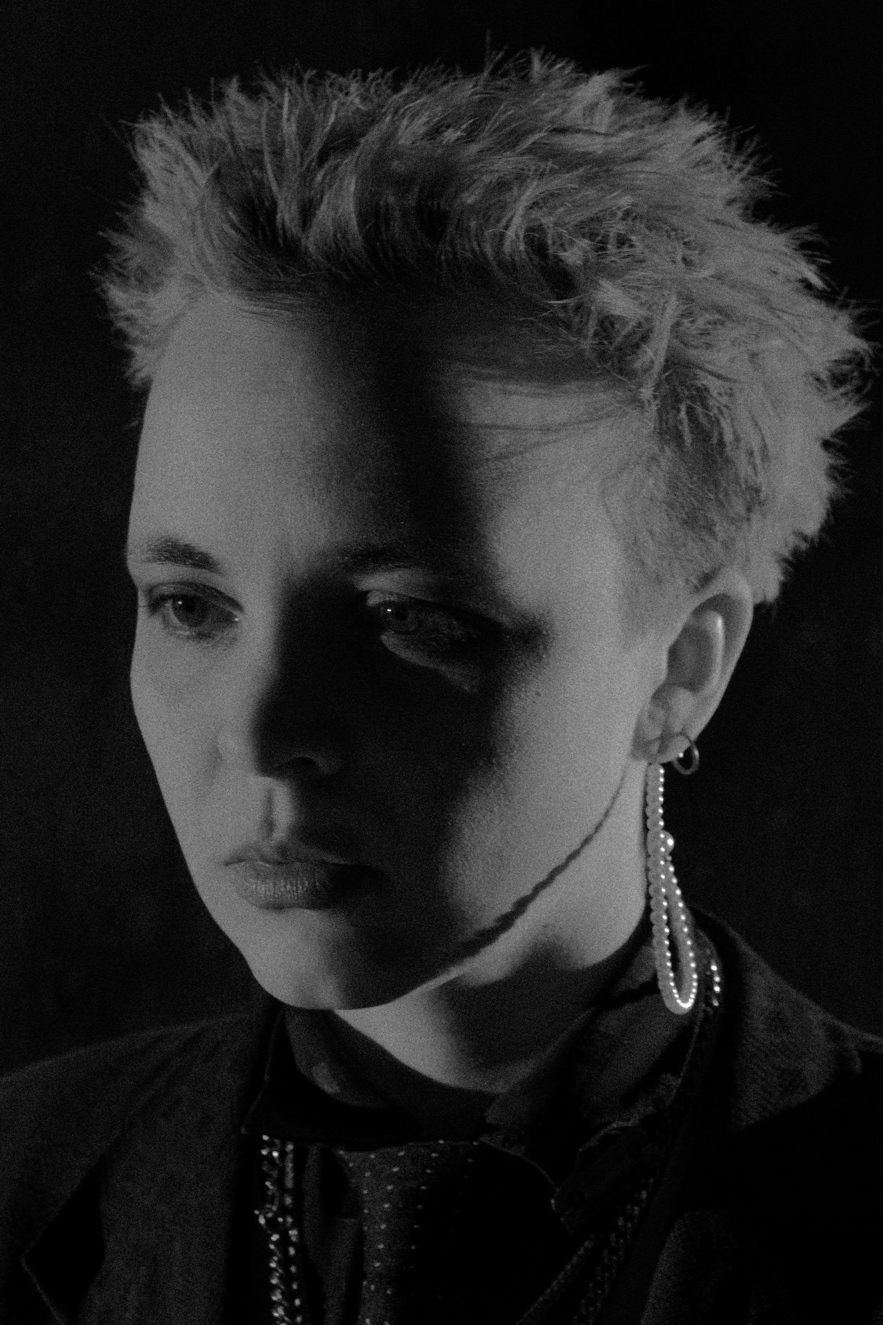 A black and white portrait photo of a person is shown. 