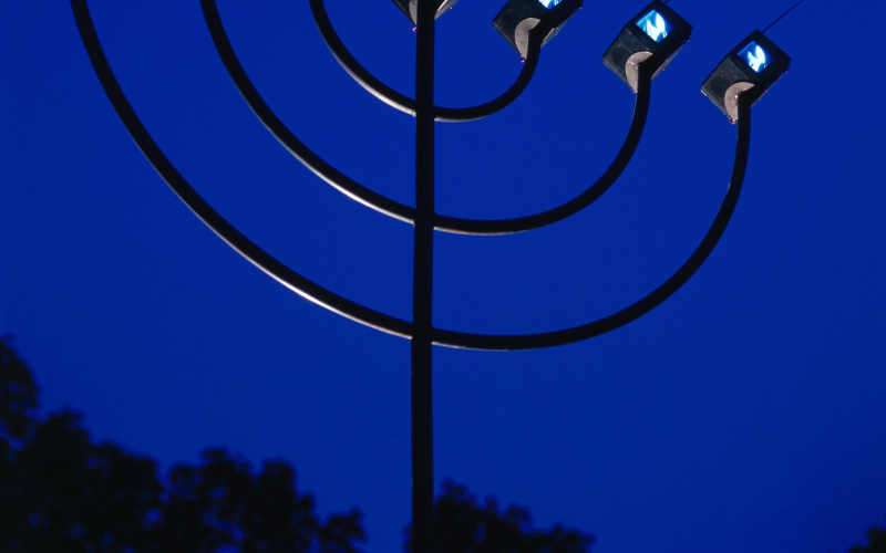 A video sculpture in the form of a menorah with small tv stations, the work is called "Menora" and was created by Michael Bielicky.