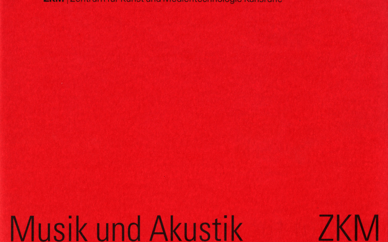 Red cover with black writing.