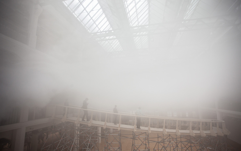 Several people walking over the ramp in the ZKM-Cloud