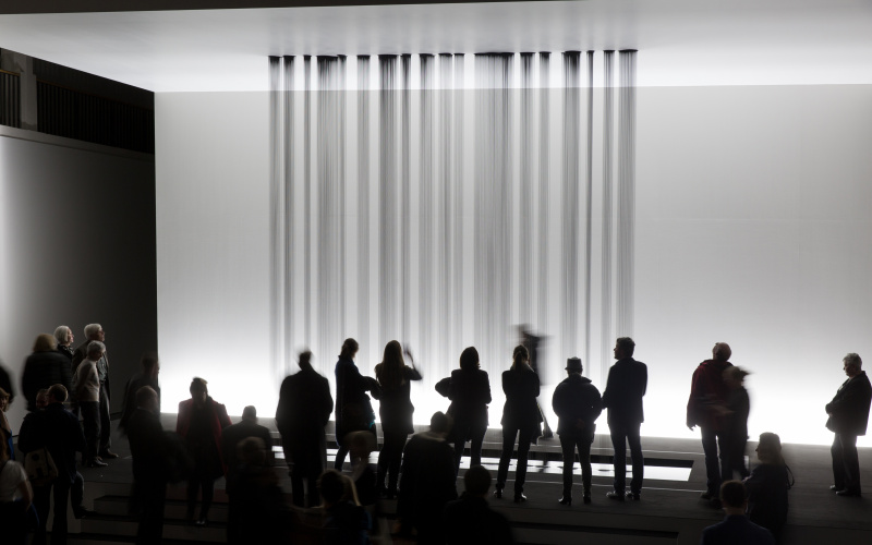 Several beams black liquid flowing from the ceiling