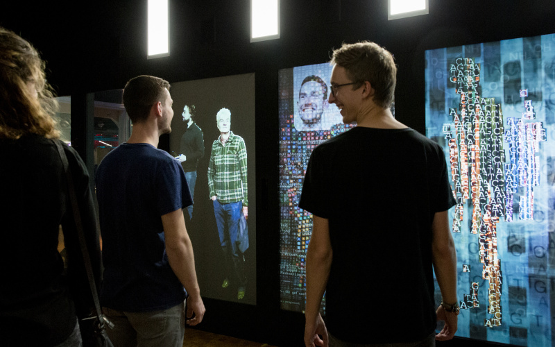 People in front of the installation »YOU:RE:CODE« 