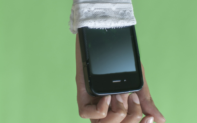 Forearm with smartphone put in the sleeve