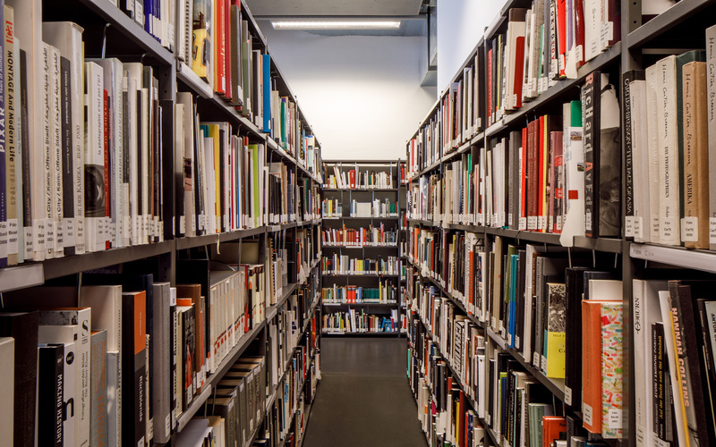 You can see many shelves filled with books.