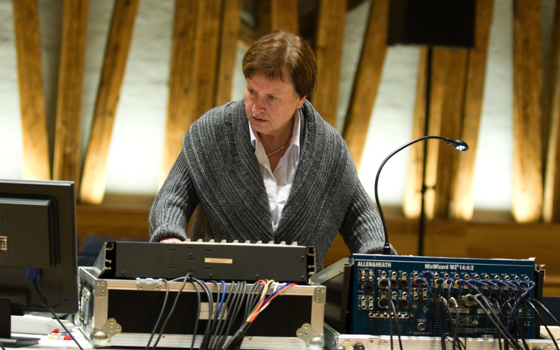 The musicologist Annette Vande Gorne operates a mixing console.