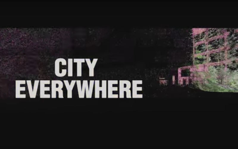 The lettering "City Everywhere" against a black background with an industrial building.