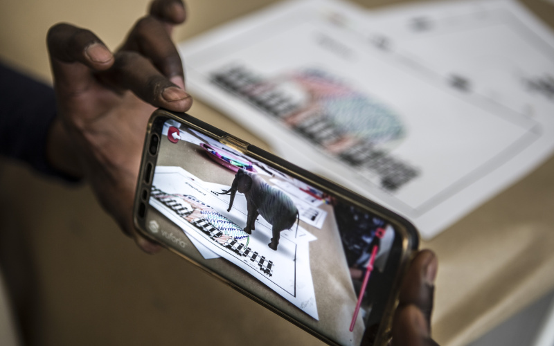 On a mobile phone display an elephant appears in Augmented Reality