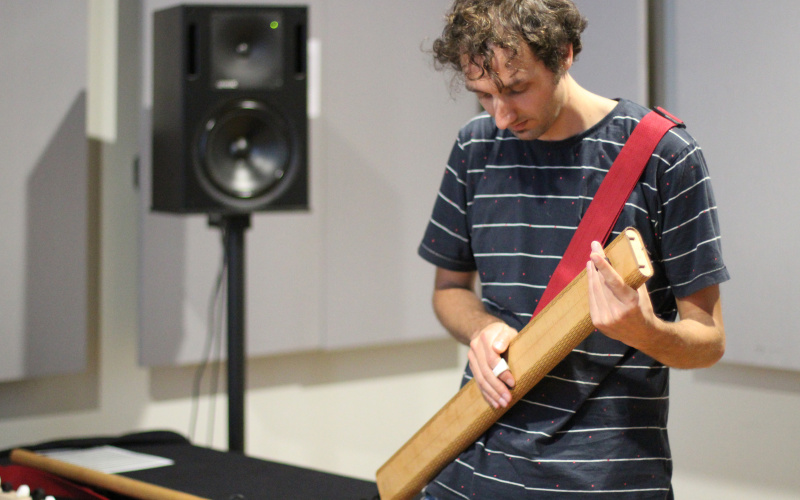 A man plays on a musical instrument