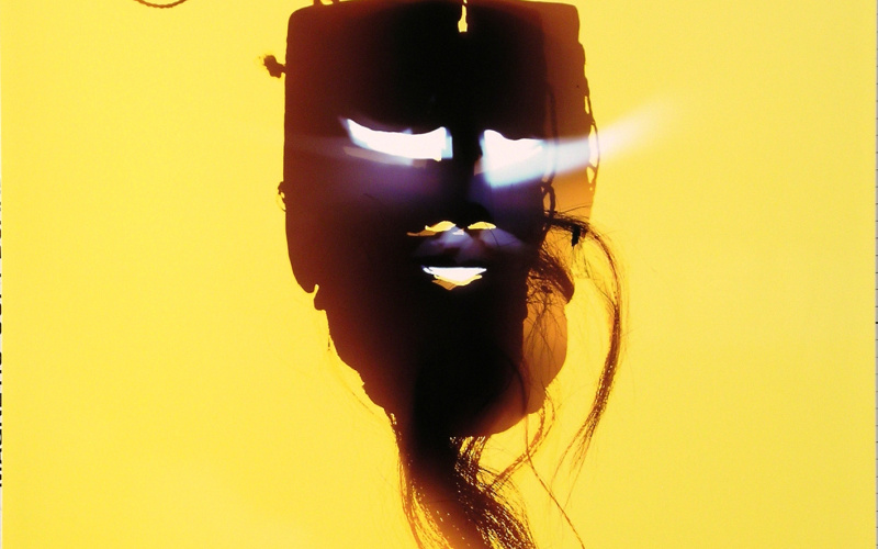 Mask against a yellow background