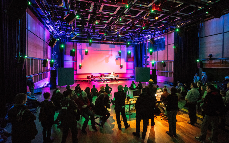 A concert inside the ZKM Klangdom with atmospheric lights.