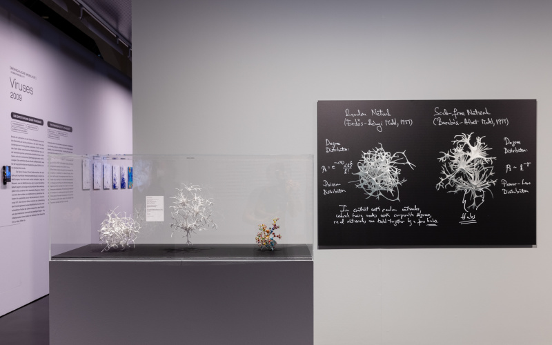Exhibition view with »Network Canon« as a 3D model and image on the wall.