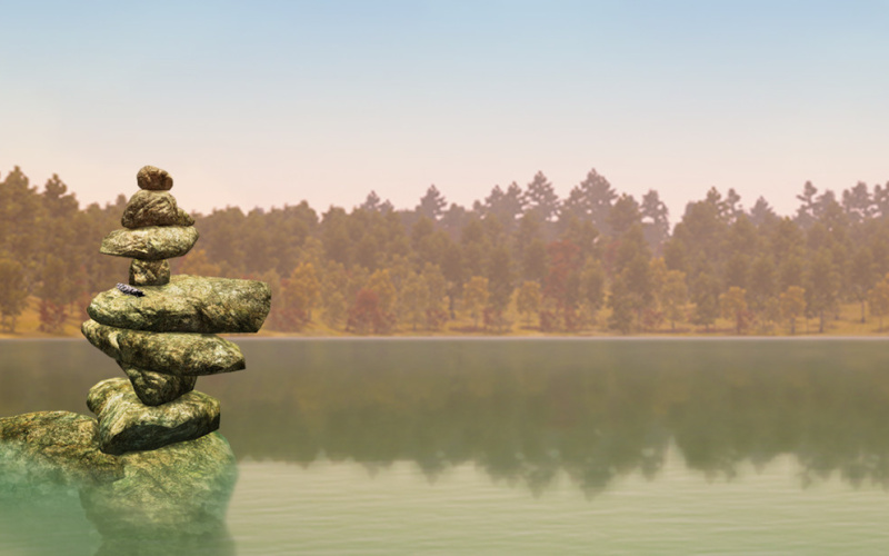 The image shows a clip from the video game "Walden a Game". You can see a wide lake with trees at its edge. On the left are stones piled up to form a meditative sculpture