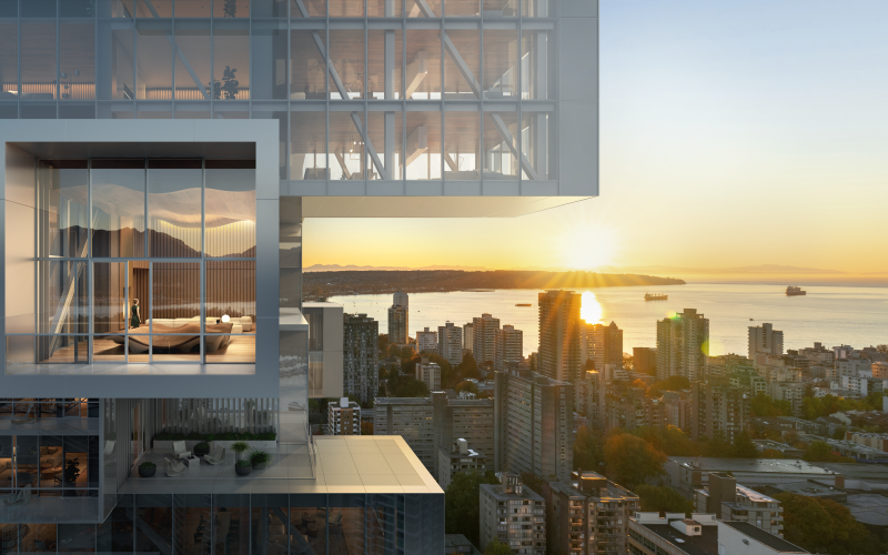 In the foreground of the picture you can see a large and very modern building. In the background you can see the city and the many other buildings and a lake. The sun is just setting and shines through the angles of the house.