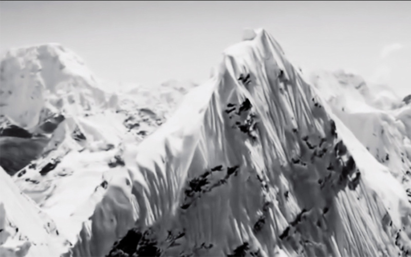 A snow-covered mountain range. Excerpt from the film "Nature" by Artavazd Pelechian