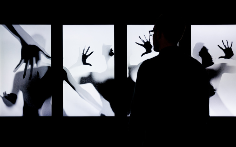 Work by John Sanborn, a person standing in front of it