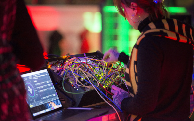 DJane at the desk with illuminated background