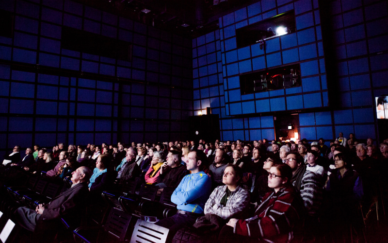 On view is an audience in the media theater.