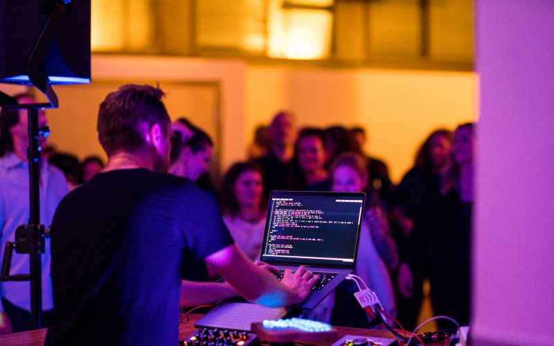 Person doing live coding at a party.