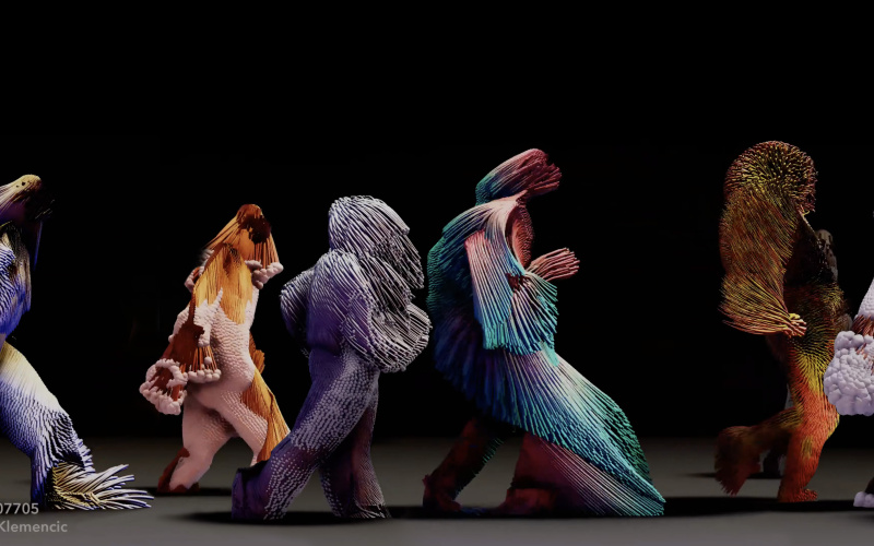 Human-like beings, made of colourful, fabric-like materials and fringes, walk in a row from left to right.