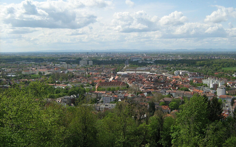 Aerial view of a city with lots of greenery.