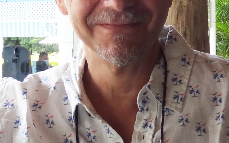 You can see a portrait photo of a person wearing a printed shirt.  