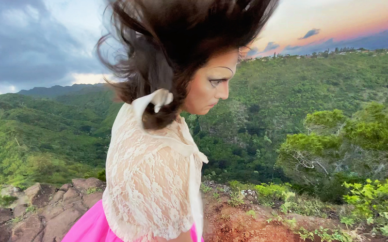 The picture shows a slanted figure standing on a slope