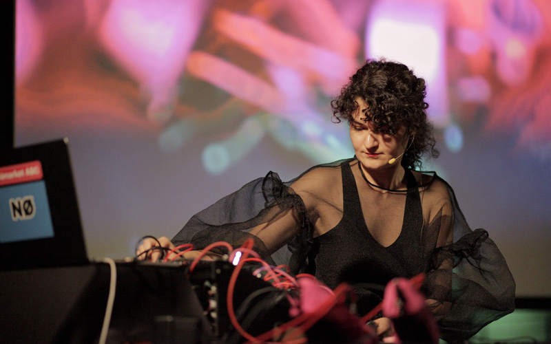 The picture shows a person making music at a concert.