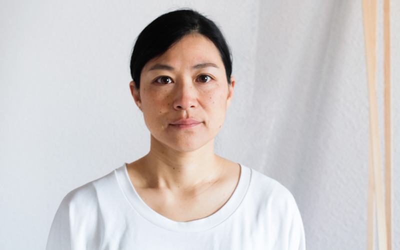 Portrait of a person in front of a white background.