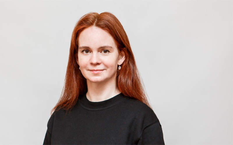 Portrait of a person in front of a white background.