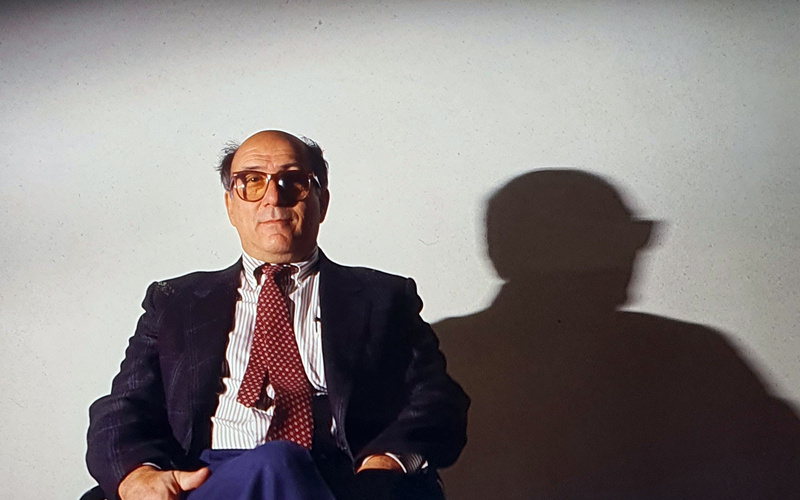 Portrait of a person in front of a white background.