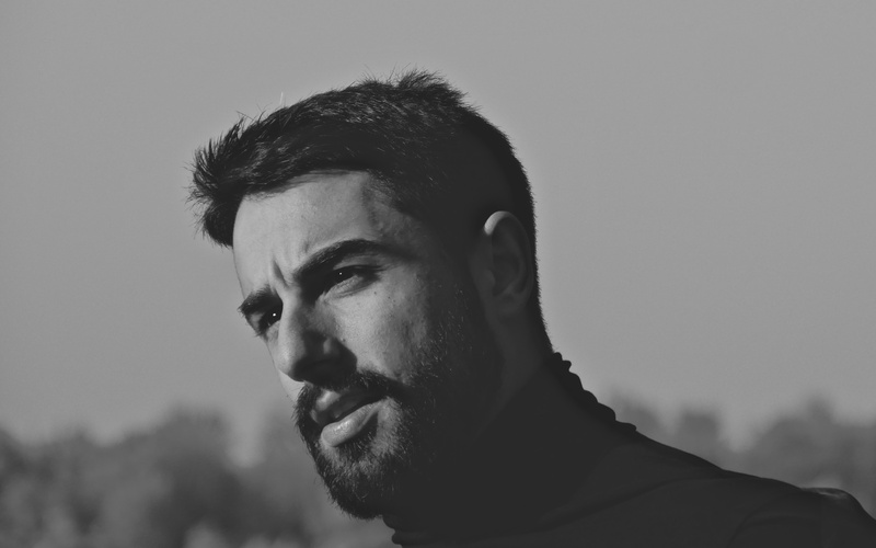 A portrait photo of a person is shown.