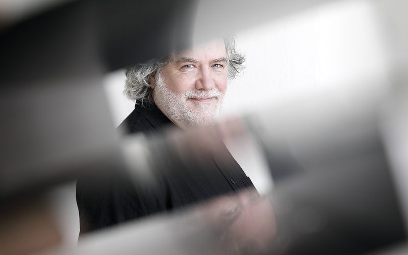 A portrait photo of a person is shown. 