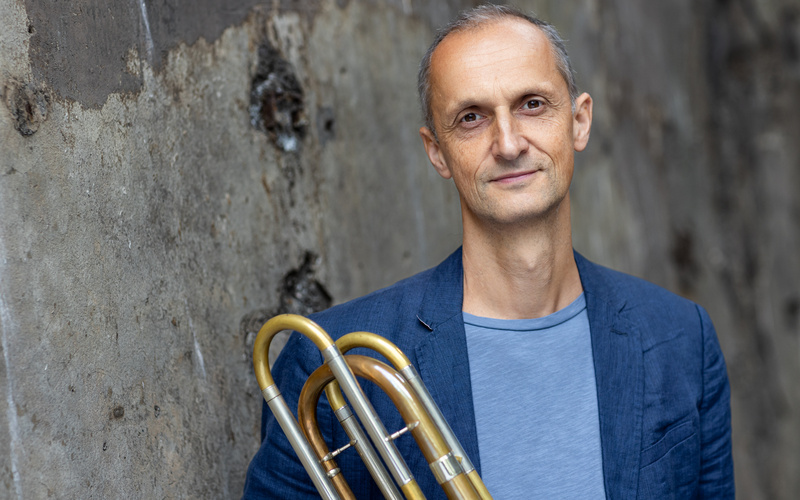 A portrait photo of a person is shown. 