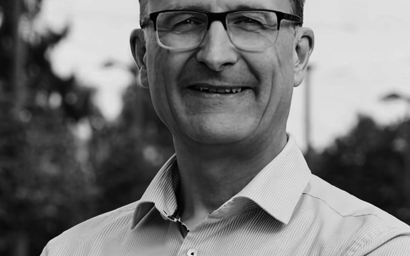 A portrait photo of Michael Beigl is shown. 