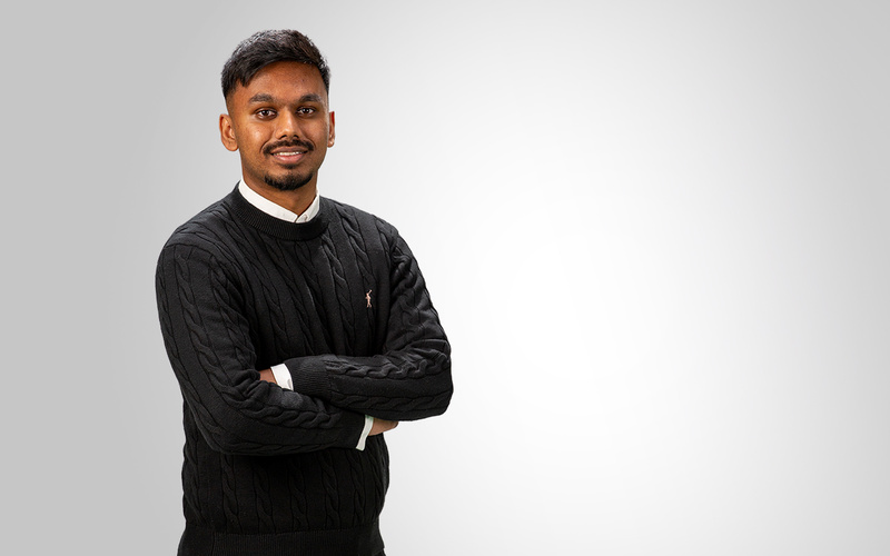 Portrait of Raoul Balakumar wearing a black sweater.
