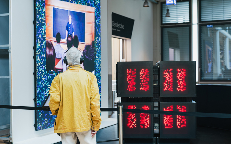 A person is looking at the Connection Machine.