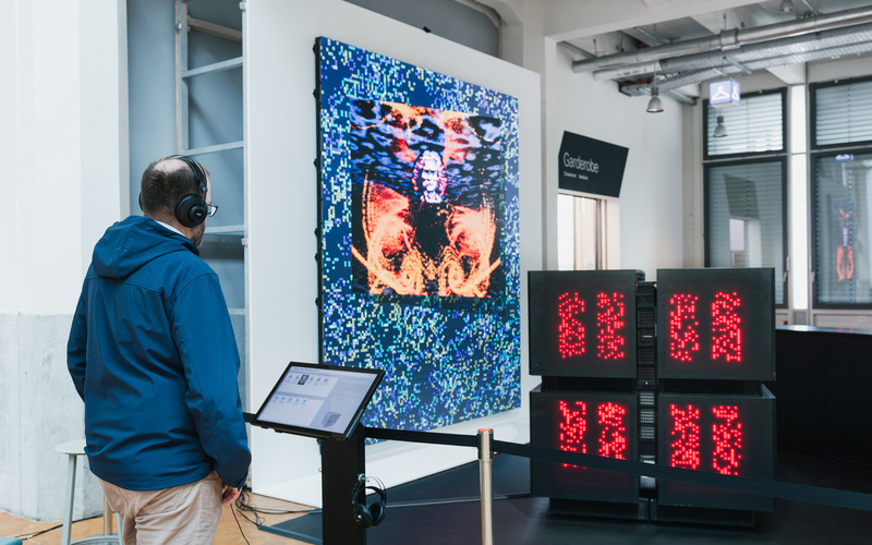 A person is looking at the Connection Machine.