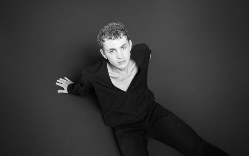 A black and white portrait photo of a person is shown. 