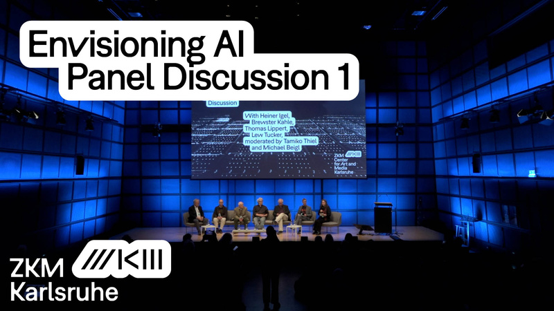 People are sitting on stage