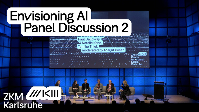 People are sitting on the stage of the media theater