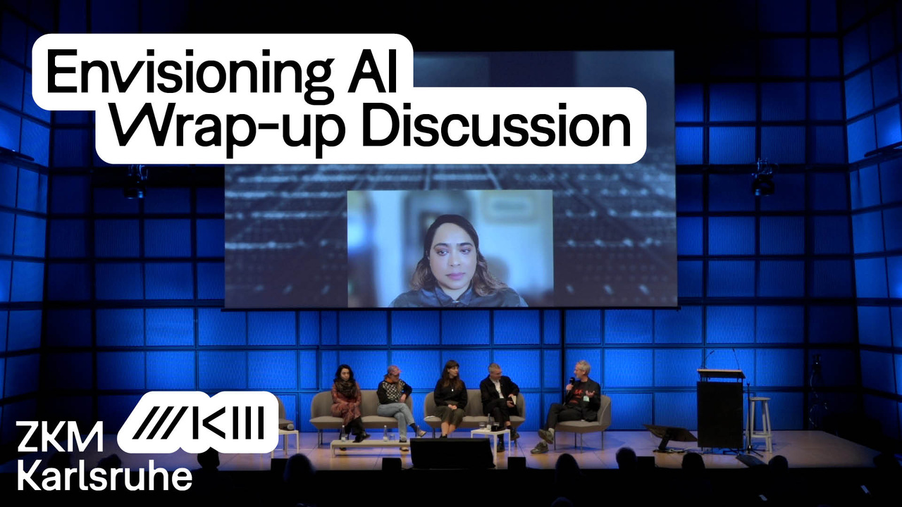 People are sitting on the stage of the media theater