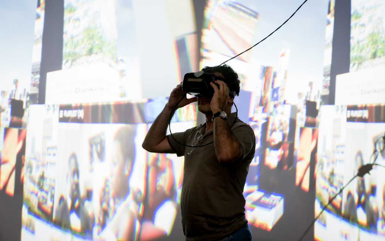 A man looking through 3-D glasses