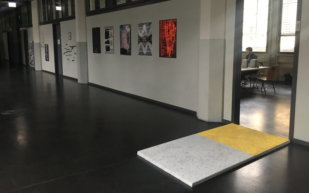 In front of the entrance to the seminar room of the Critical Zones Study Group at Karlsruhe University of Arts and Design (HfG) there is a foam folder on the floor as a test for all seminar participants.