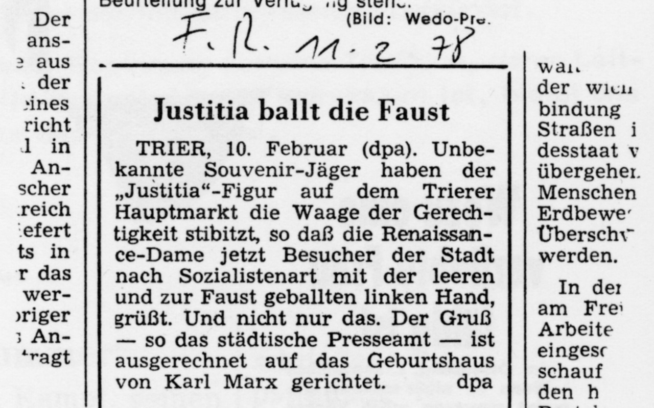 Zeitungsartikel mit der Überschrift: Justitia ballt die Faust