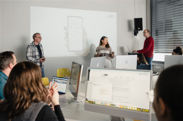Several people at an employee training course.
