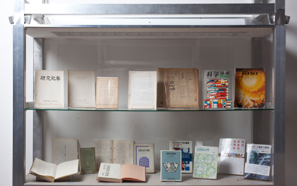 View into a display case with publications by Hiroshi Kawano.